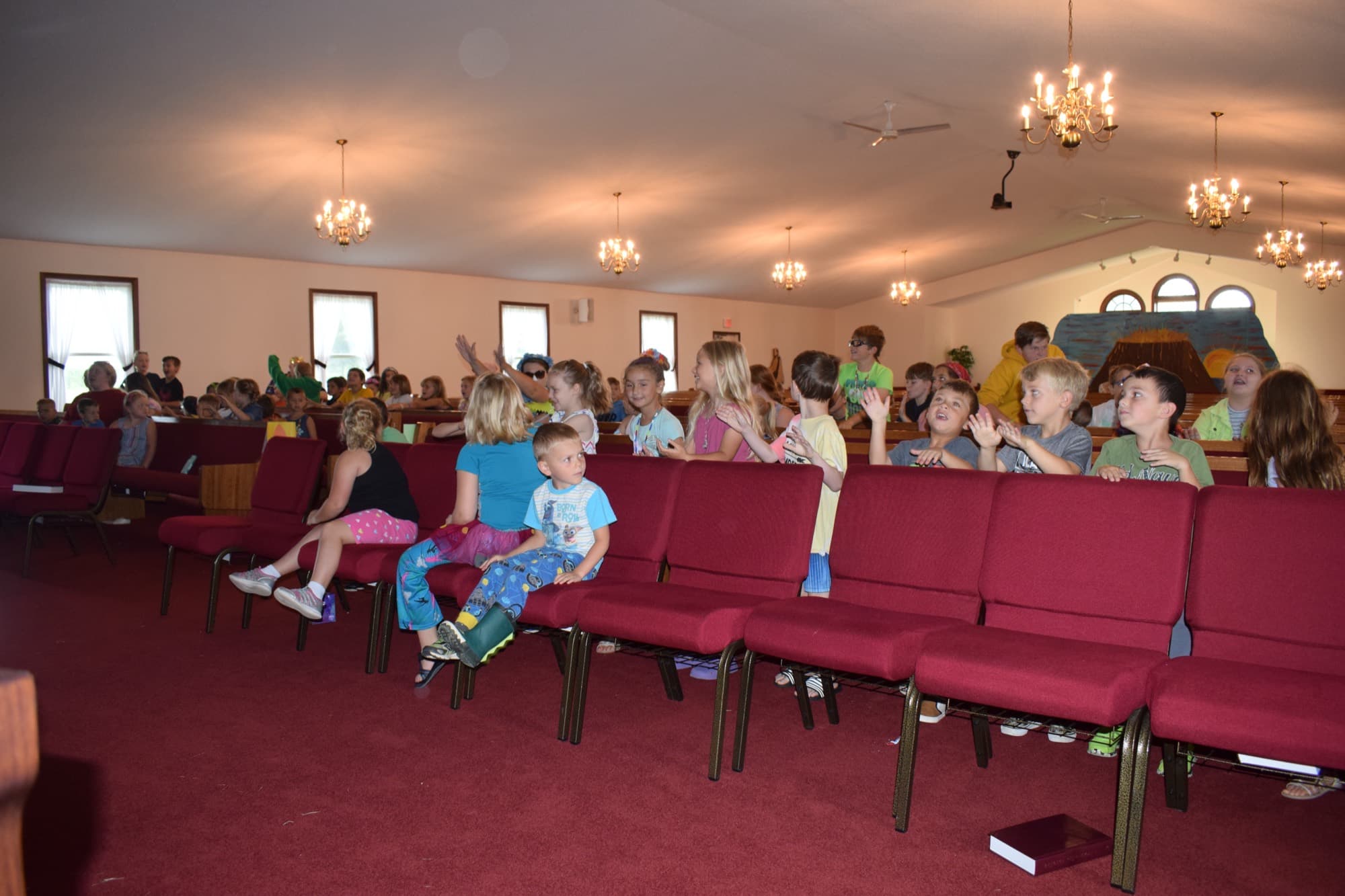 Children seated in the auditorium pews at Blissfield Baptist Church