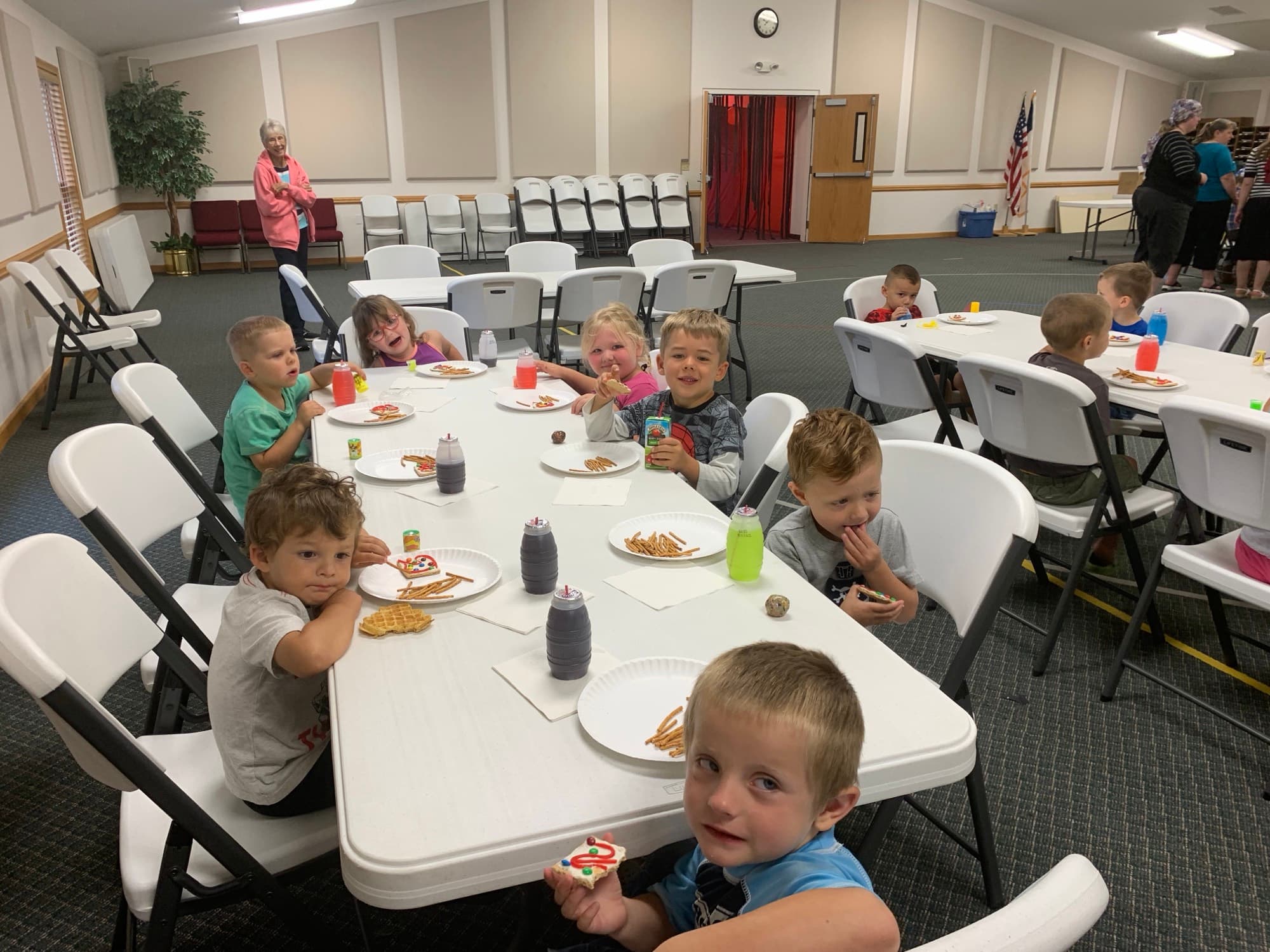 Young children at snack time in the fellowship hall