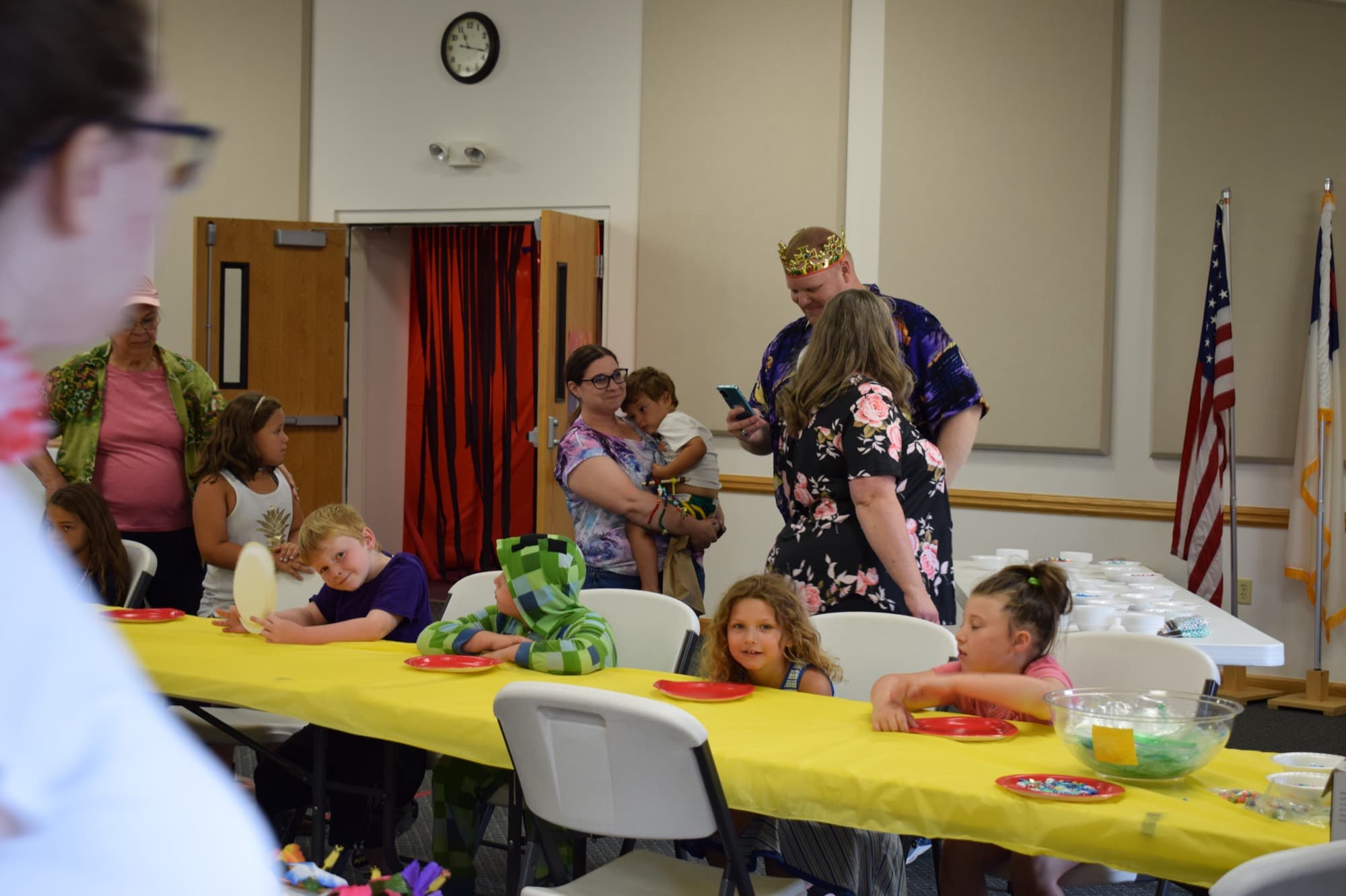 Families around the tables during Vacation Bible School
